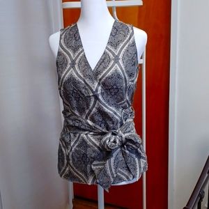 Very elegant blouse with sash that you can either tie at the back or front.